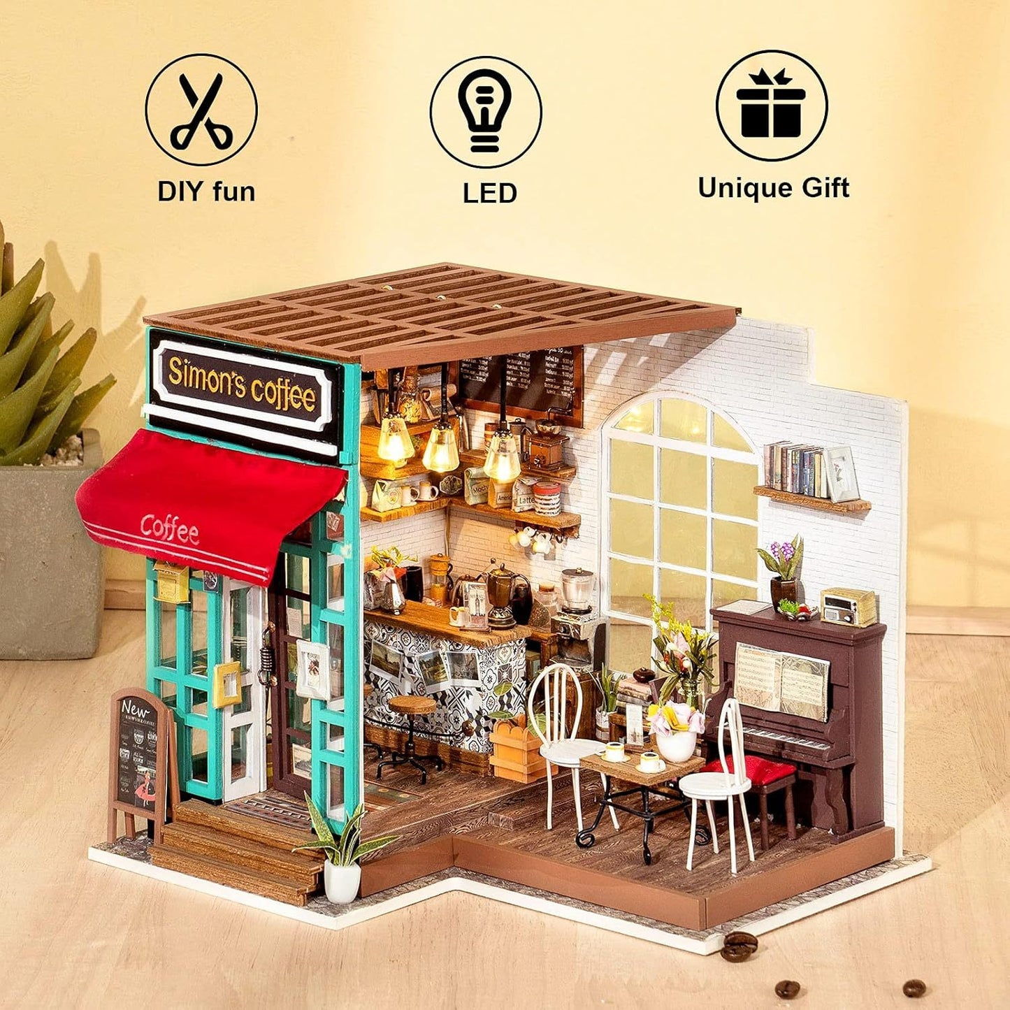 Miniature model of a coffee shop with 'Simon's Coffee' sign, LED lights, and DIY fun features on a beige background. 1.24 scale miniature size