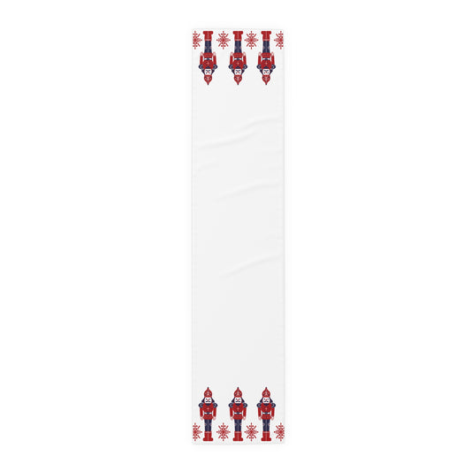 White table runner with red and blue decorative elements on a white background