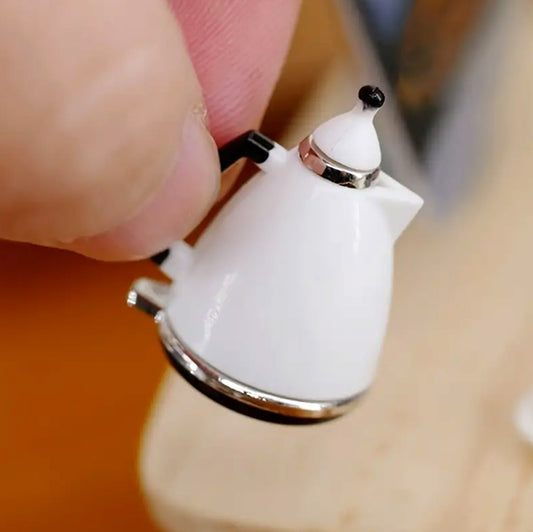 white-kettle-in-hand