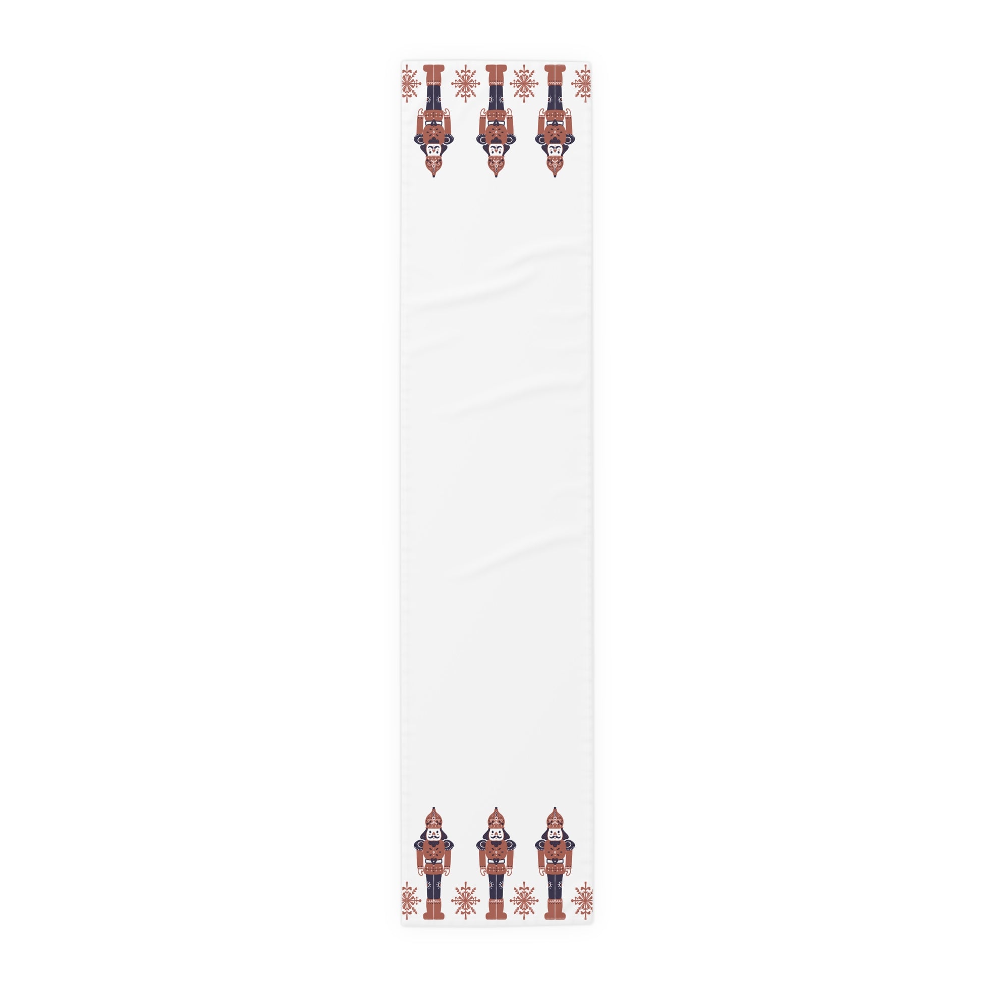 White table runner with decorative nutcracker pattern on a white background
