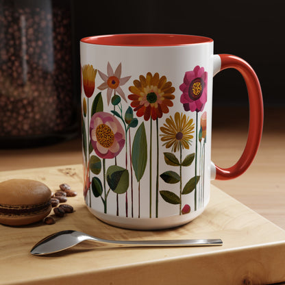 15 oz Floral-patterned mug with red interior and handle on a wooden surface with coffee beans and a macaron.