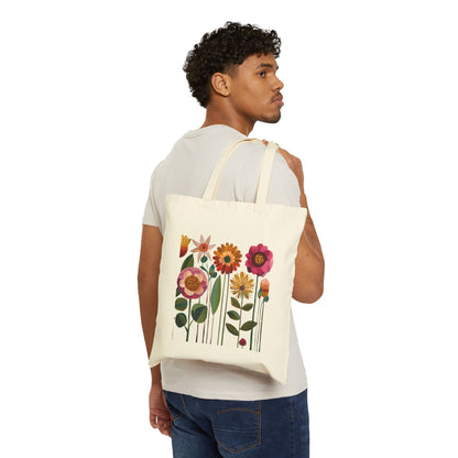 Man carrying a tote bag with floral design on a white background