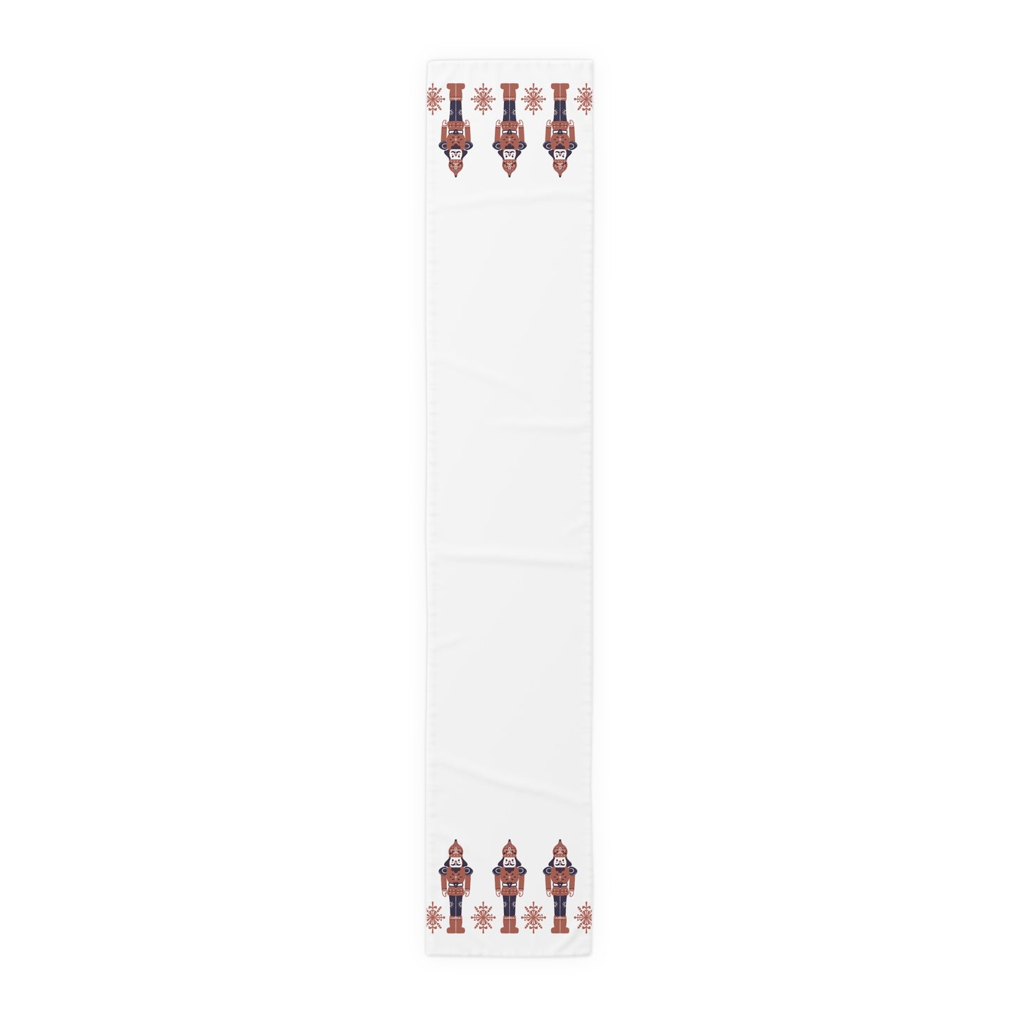 White table runner  with red and blue nutcracker design on a white background