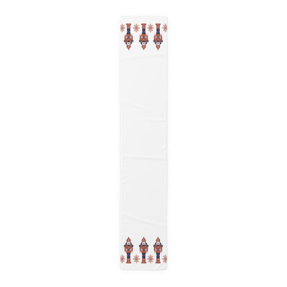 White table runner  with red and blue nutcracker design on a white background
