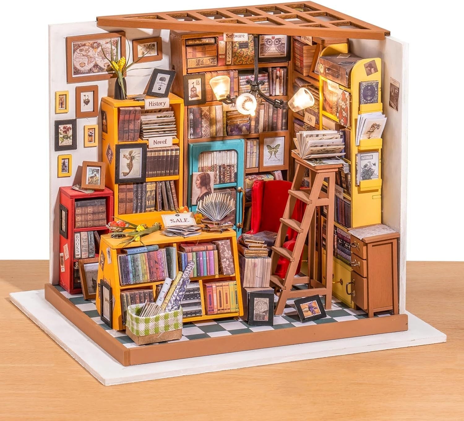 Miniature model of a bookshelf with books and decorative items on a white background 1.24 scale miniature size