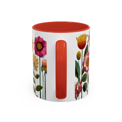 Mug with floral design and red interior on a white background