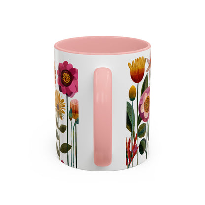 Mug with floral design and pink handle on a white background