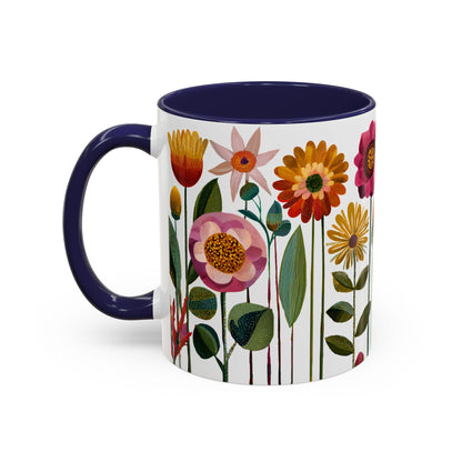 Mug with floral design and blue handle and blue interior on a white background