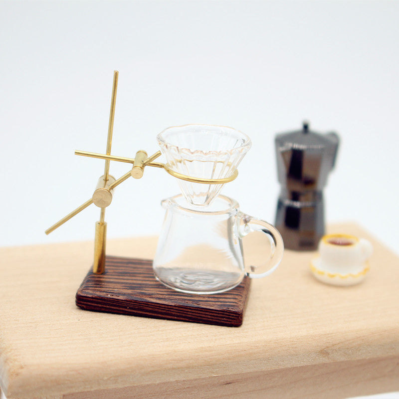 1/12 Scale Dollhouse Glass coffee maker with wooden base on a light wood surface