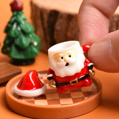 Here is an SEO-optimized title, product description, and meta description crafted specifically for your Shopify listing:  SEO Title Mini Santa Teacup Figurine - 1/12 Scale Christmas Dollhouse Decor