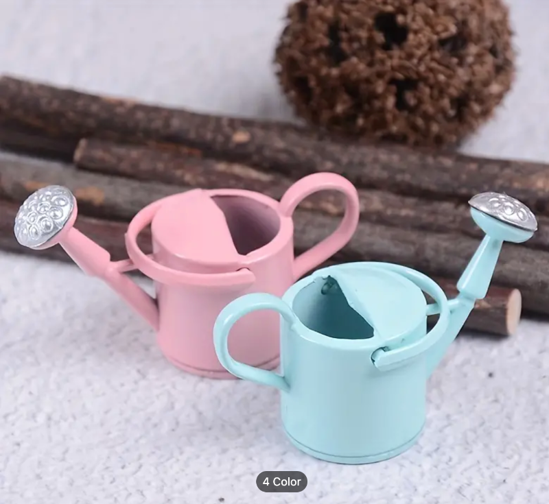 pastel colored watering cans