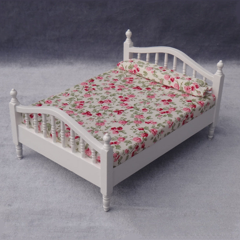 Dollhouse bed with rose bedding