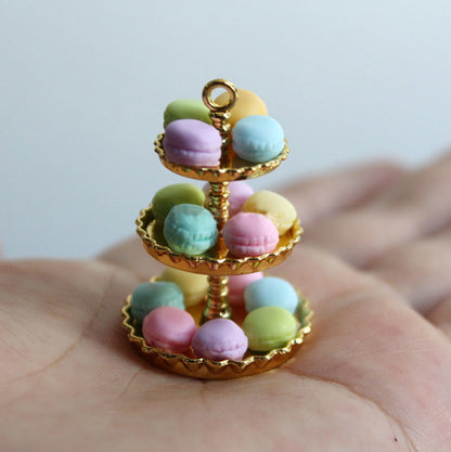 gold three tiered stand with macarons