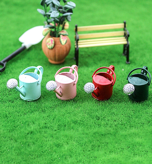 4-watering-cans-in-grass