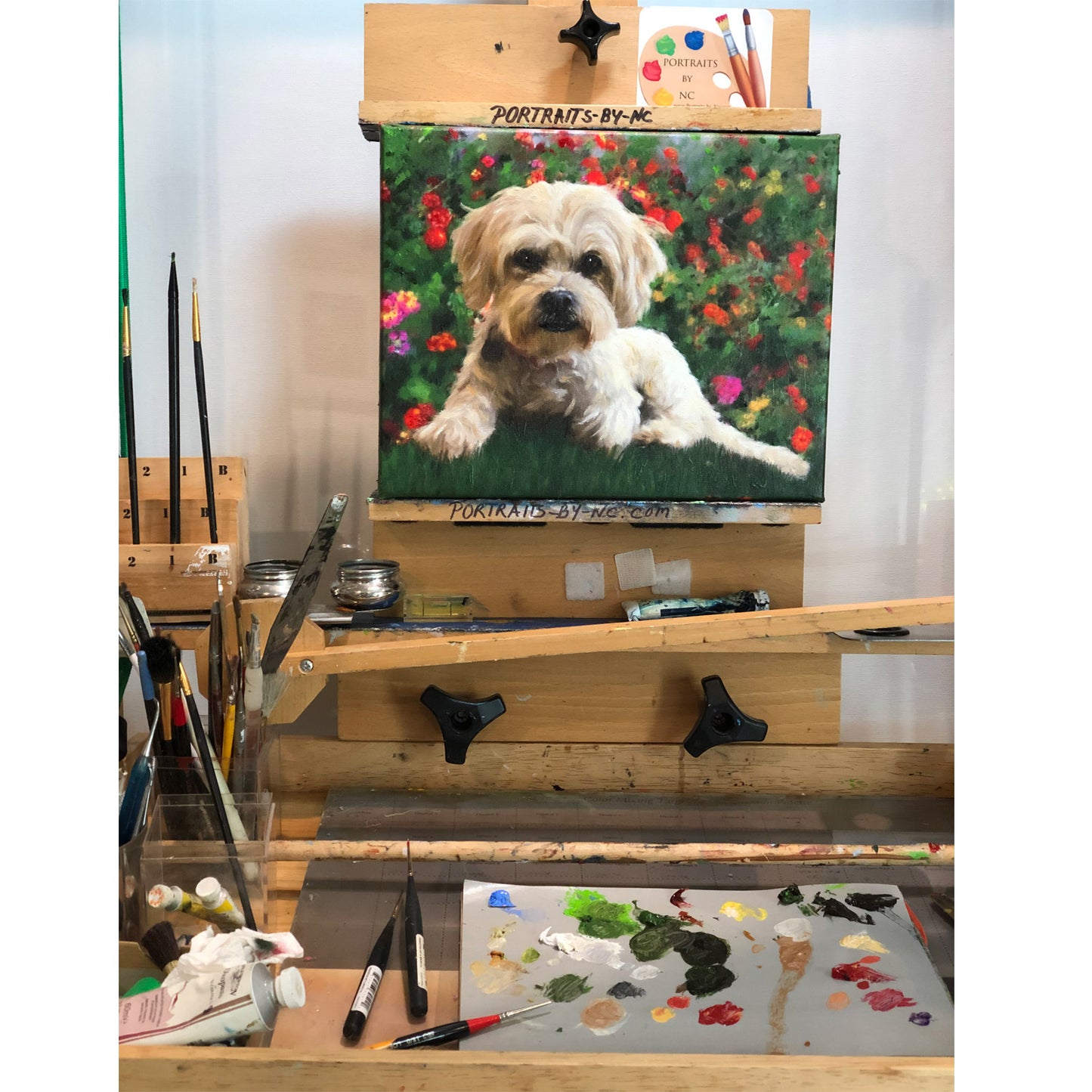 Lhasa Apso/poodle mix painting on easel