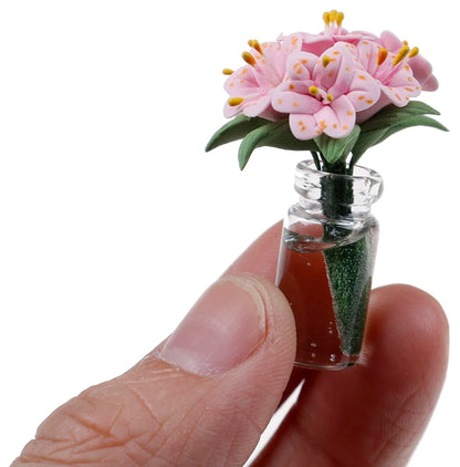 Pink-Lilies-in-Glass-Vase-in-hand