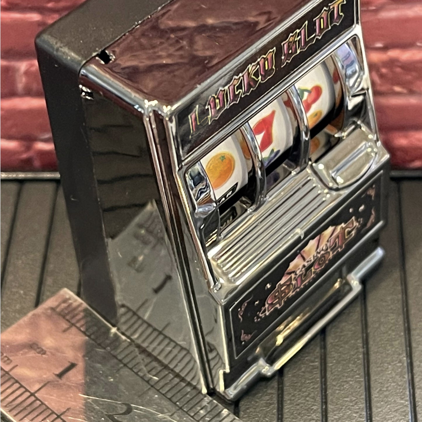 Miniature slot machine side view